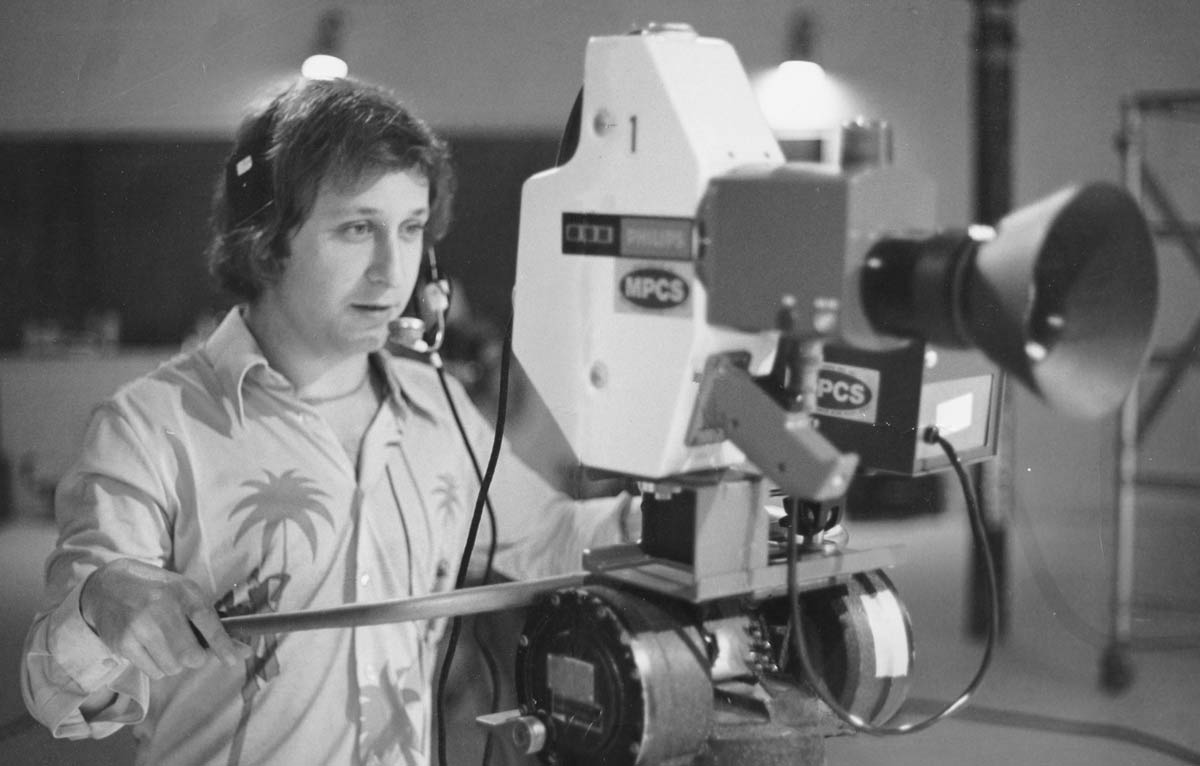 A young Sheldon Richman behind a studio TV camera